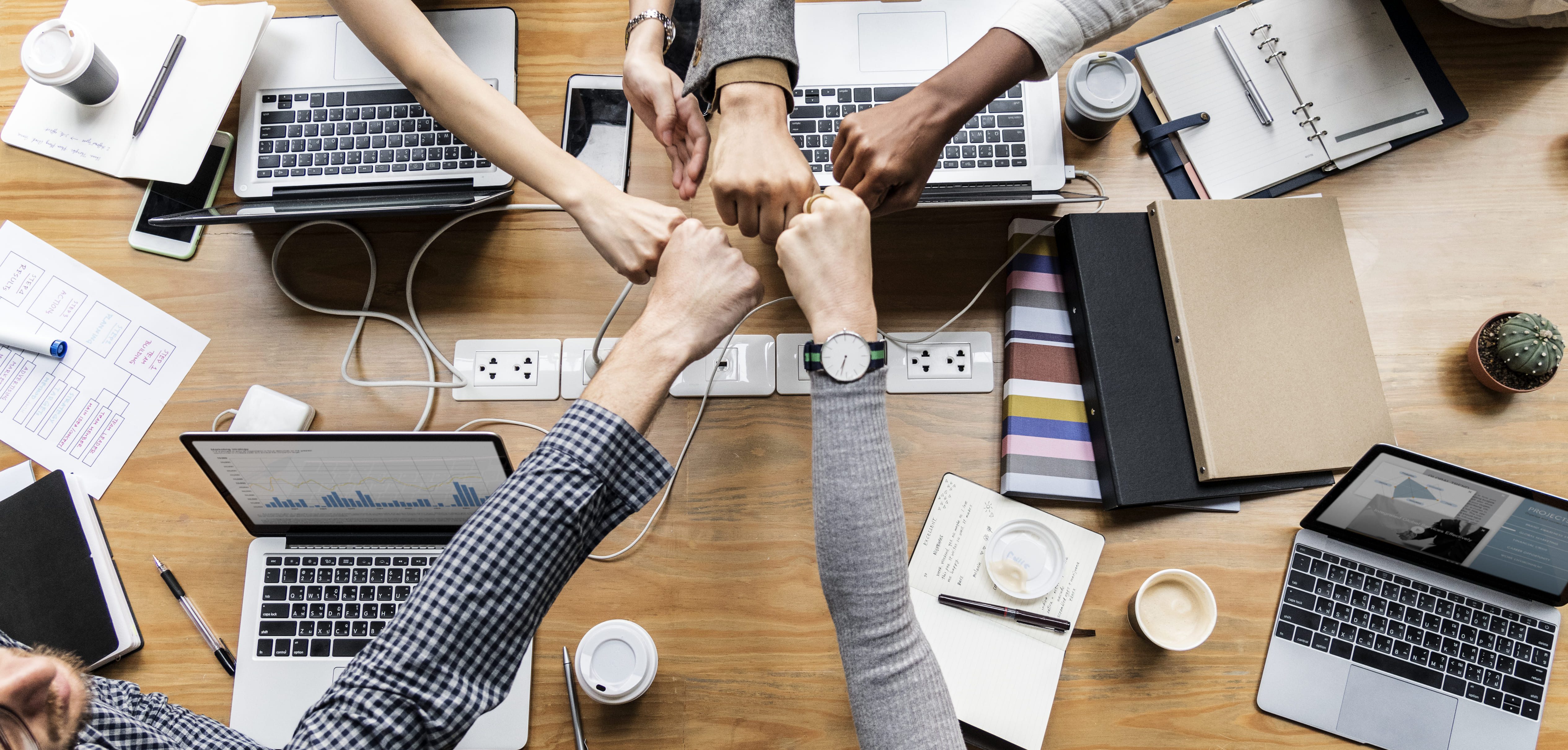 colleagues-giving-fist-bump--MOSTWA